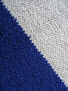 Blue and white carpet background closeup