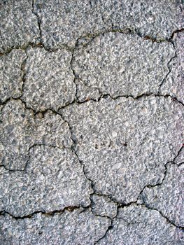 Cracks on asphalt background