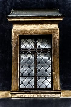 Ond window of old building closeup in Prague