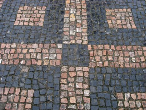 Texture of black and red stone structure road in Prague 