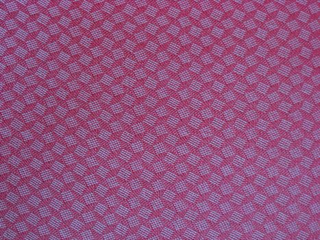 Texture of red fabric background closeup 

