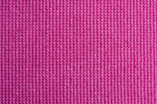 Texture of pink fabric background closeup 