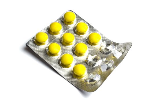 Package of Yellow Pills isolated on white background
