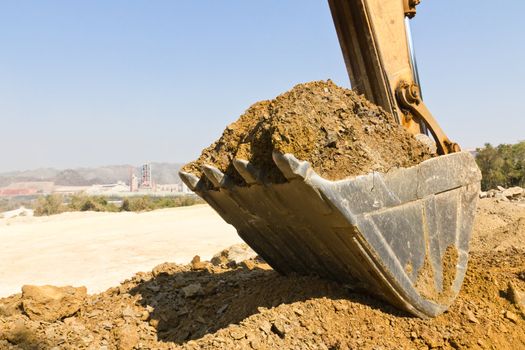 excavator loader during earthmoving works outdoors  at the quarry