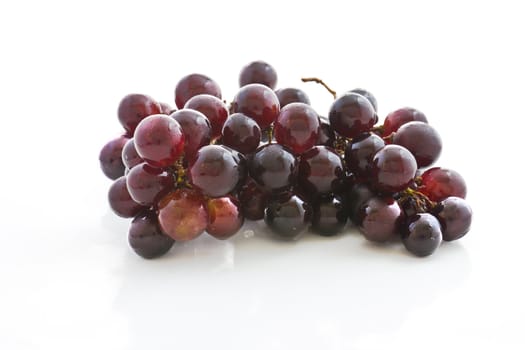 Fresh grape cluster on white background