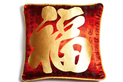Beautiful red cushion with Chinese characters isolated on white