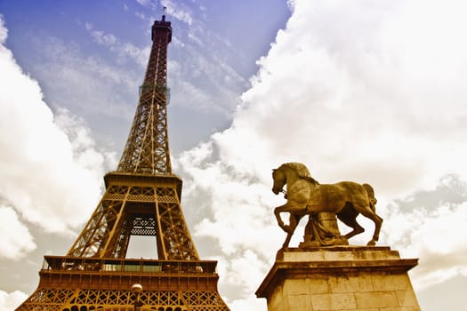 Closeup Eiffel tower in cloudy sky ,Paris ,France 