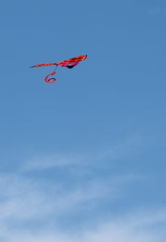 Red cute Kite against the blue sky