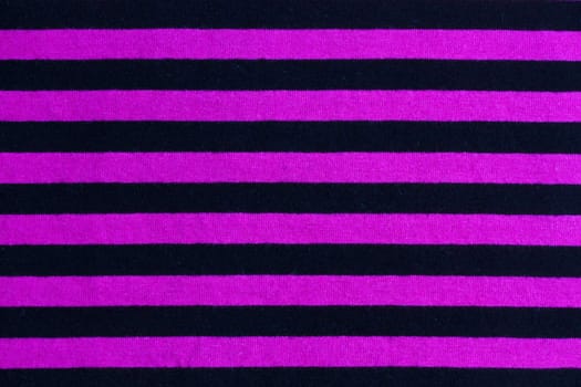 Texture of pink and black striped fabric background