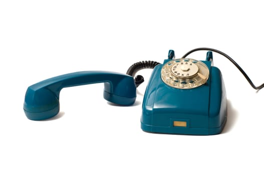 Old dial telephones with removed  receiver isolated on a white background.