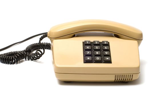 Old Beige key telephone system on a white background.