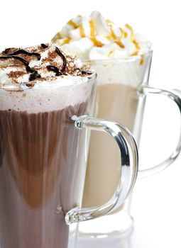 Hot chocolate and coffee latte beverages with whipped cream