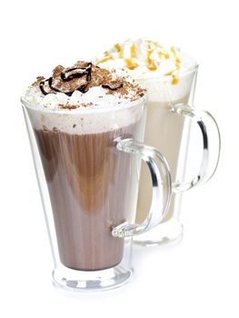 Hot chocolate and coffee beverages with whipped cream isolated on white background