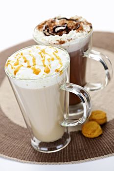 Hot beverages of coffee and chocolate with whipped cream