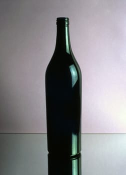 A empty wine bottle isolated on mirror