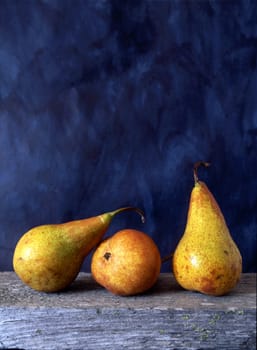 Three pears isolated on painted background