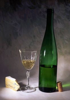 White wine and cheese isolated on painted background