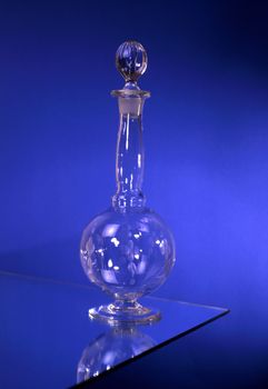 Elegant carafe isolated on blue background