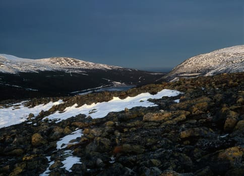 Mountain landscape with snow and lake