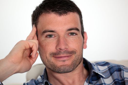 beautiful man relax on sofa at home