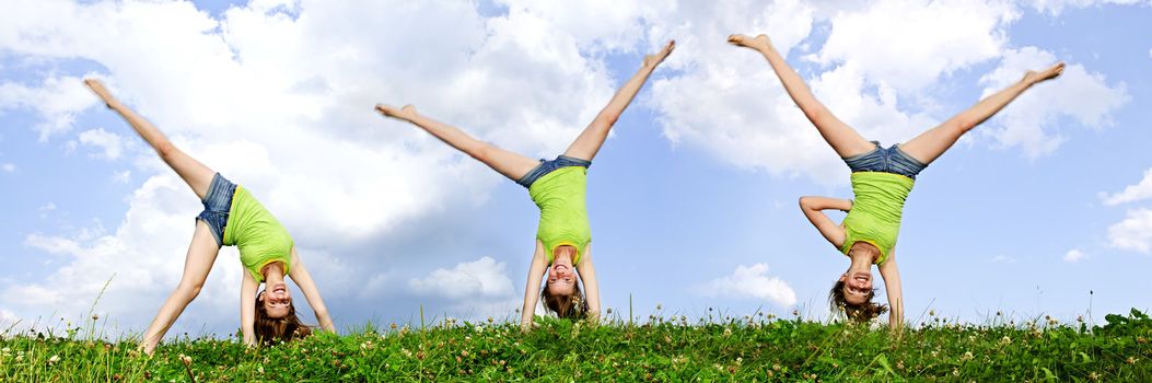 Composite image of young teenage girl doing cartwheel in a summer meadow