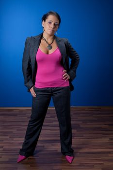 woman in a pink chair on a blue background