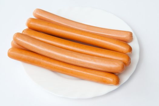 Sausages on the white plate