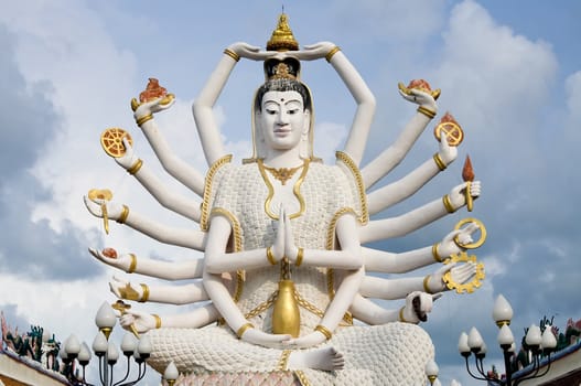 Eighteen arms Buddha over blue sky, Koh Samui. Thailand