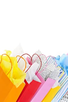 Many colorful shopping bags on white background