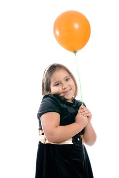 A happy birthday girl is smiling and holding  a single balloon, isolated against a white background.