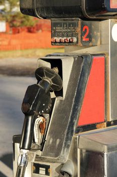 Old rusted and dirty gas pump vertical close-up.