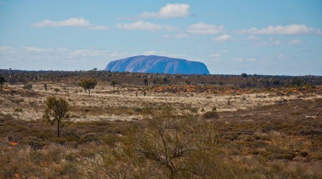 panoramic view of ayers rock, australian red center