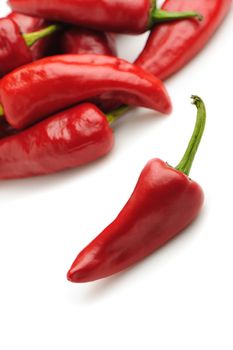 Red bitter pepper. A heap of pepper on a background