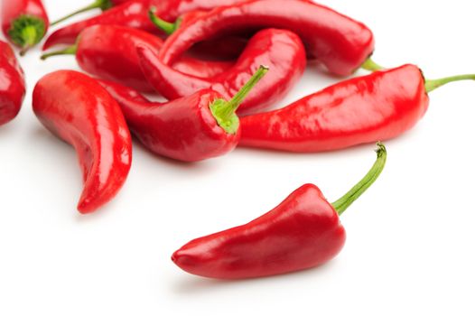 Red bitter pepper. A heap of pepper on a background