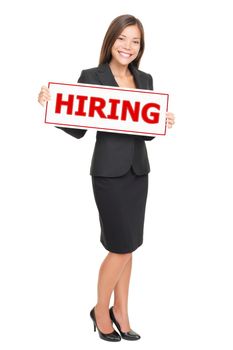 Hiring job woman holding hiring sign. Young attractive smiling Caucasian / Asian businesswoman isolated on white background.