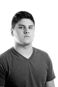 A close up of a young man with a very serious look on his face.