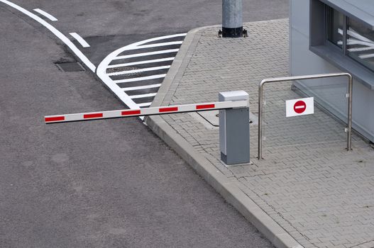 No entry, car parking barrier and control post.