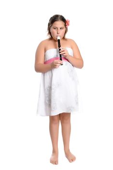 A young girl is wearing a white dress and playing the recorder flute, isolated against a white background
