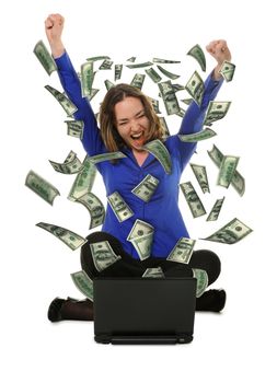The woman in front of the laptop with fly out dollars. It is isolated on a white background
