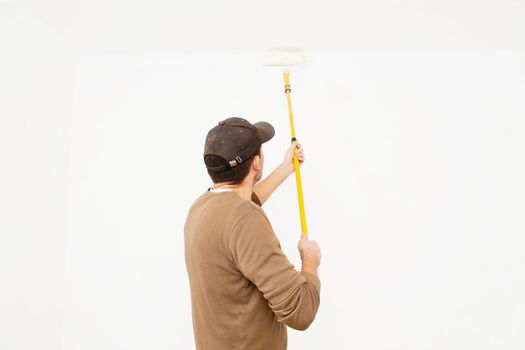 Man painting in the white room