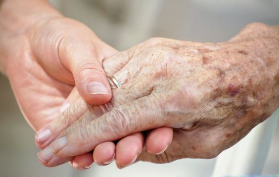 Woman gives her Grandma her Hand