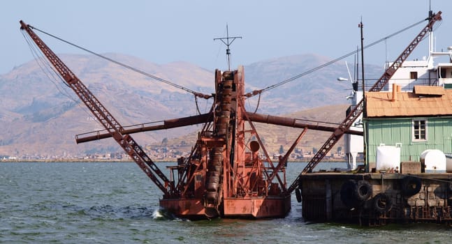 Old, rusty, dredger ship, lake Titicaca, Peru