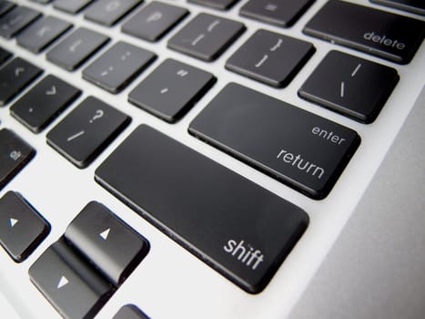 Black Enter Key on Silver Keyboard