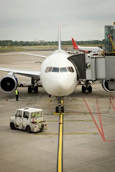 Two planes parking on the dock