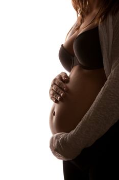 Young pregnant woman holding her belly