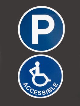 Blue Signs for Parking for Handicapped People on Grey Background