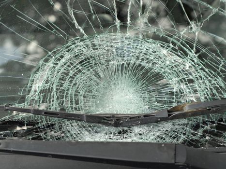 Closeup of a car's front window after an accident