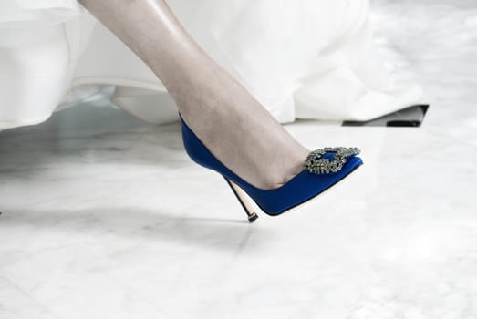 Blue Shoe on the Foot of a Bride