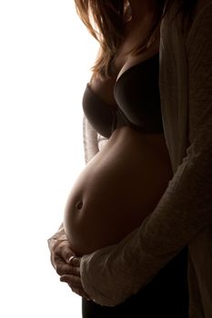 Young pregnant woman showing her belly