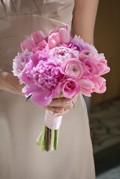 Bridesmaid with pink wedding flowers